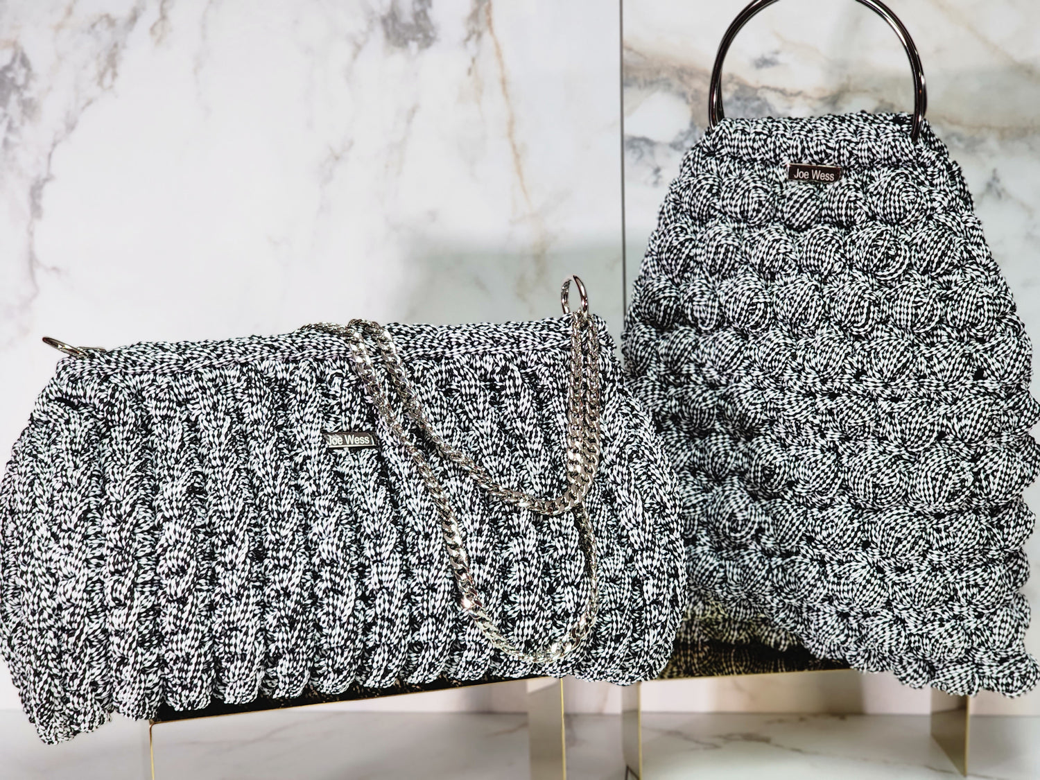 Handcrafted silver crochet purse with intricate stitching, and a refined, elegant silhouette.